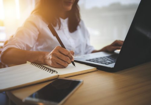 young woman  with learning language during online courses using netbook